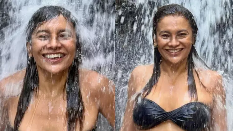 Dira Paes, aos 56 anos, irradia beleza em biquíni tomara que caia e encanta seguidores em cachoeira